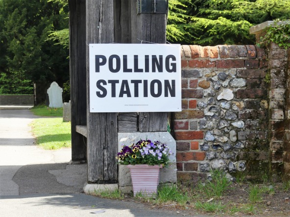 polling station sign on a wall